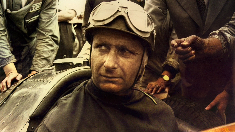 Juan Manuel Fangio in racing helmet and goggles